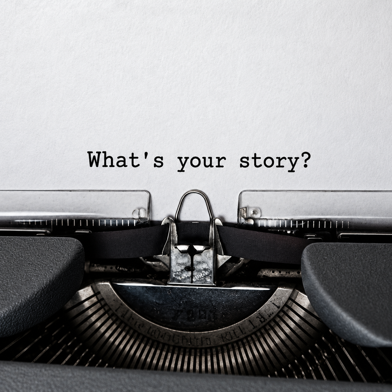 Typewriter asking what is your story